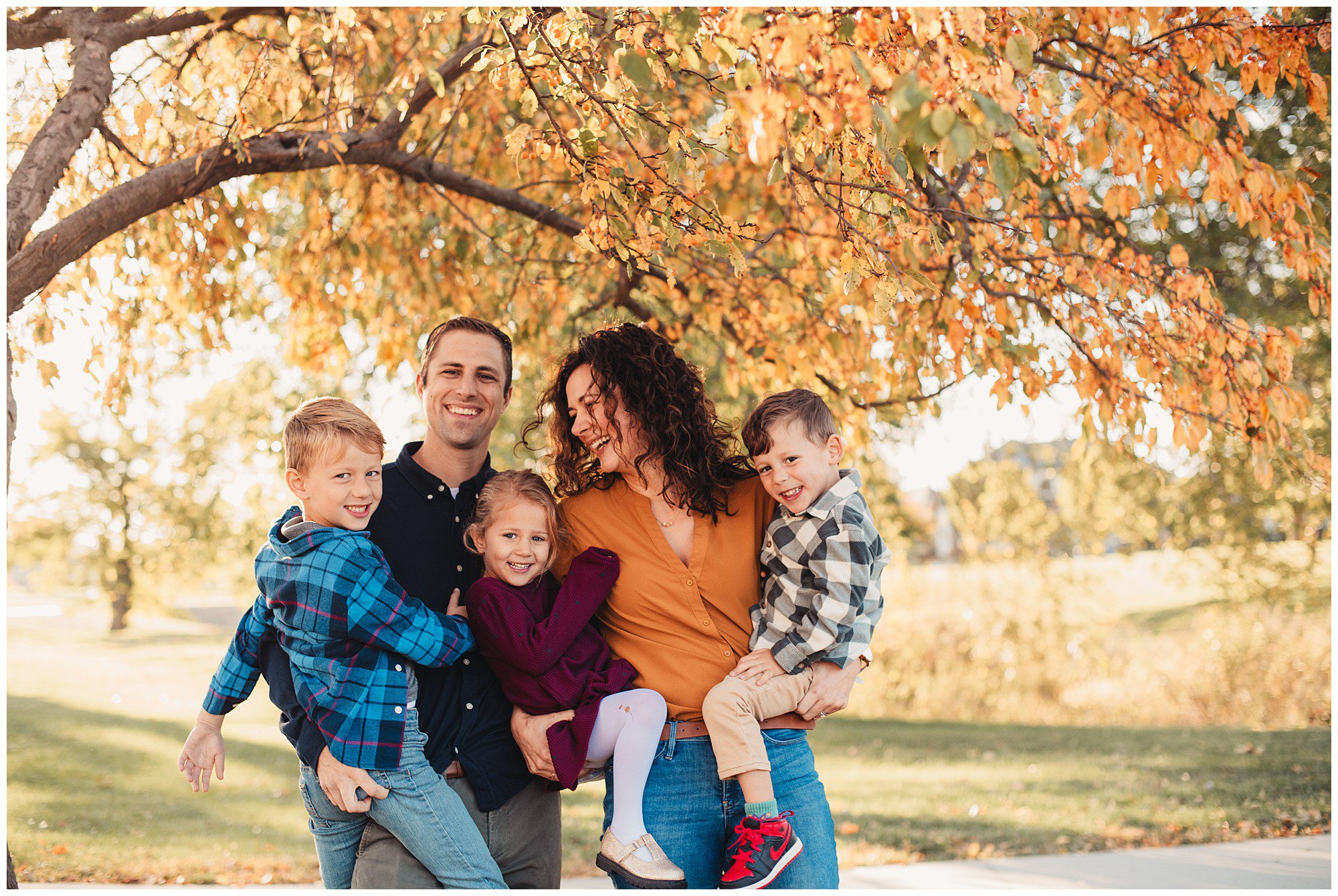 Documentary style family photography session at Meadowbrook Park in Kansas, capturing relationships and connections with each other.
