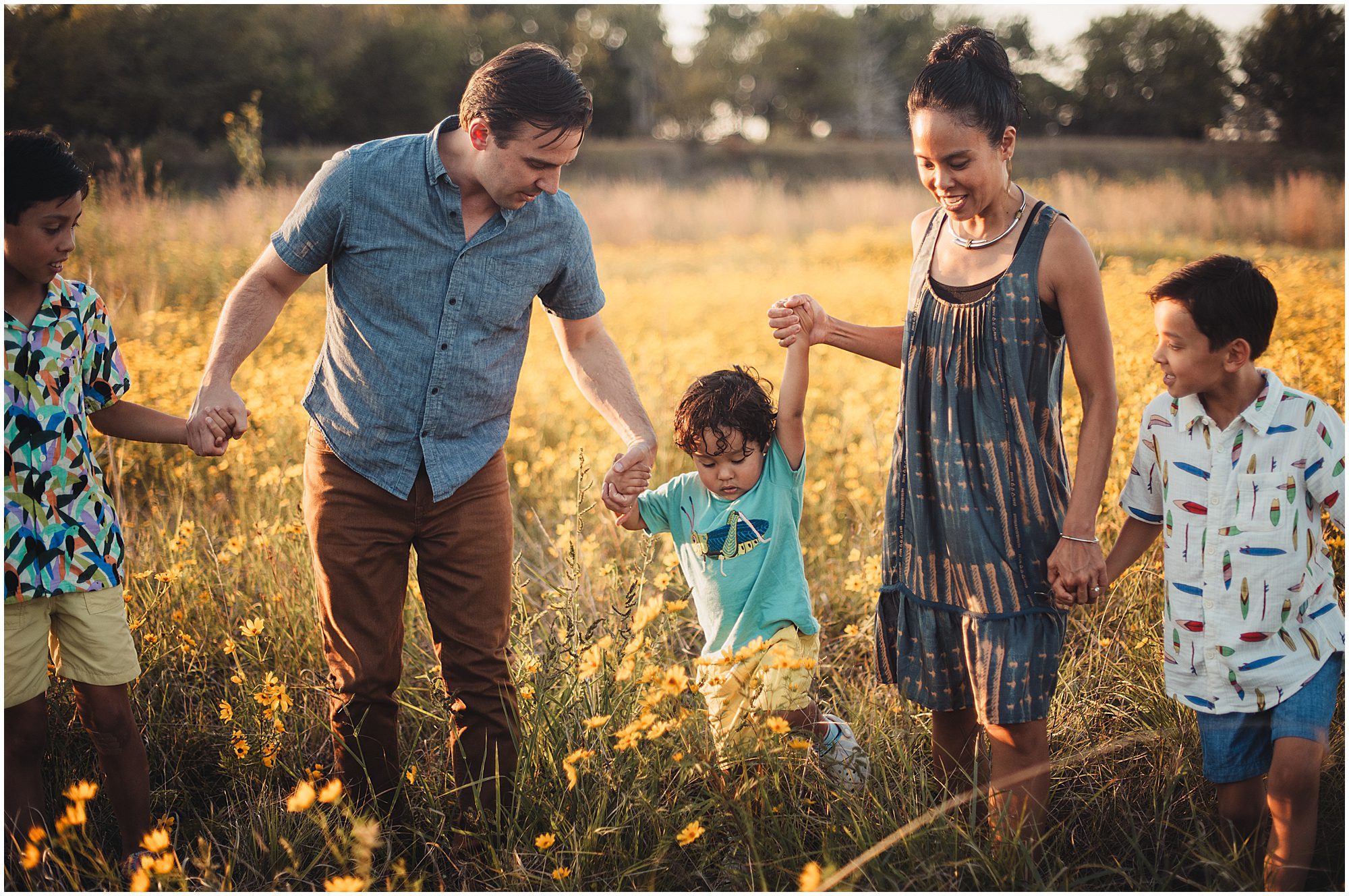 family portrait session in a Kansas Field full of wildflowers 