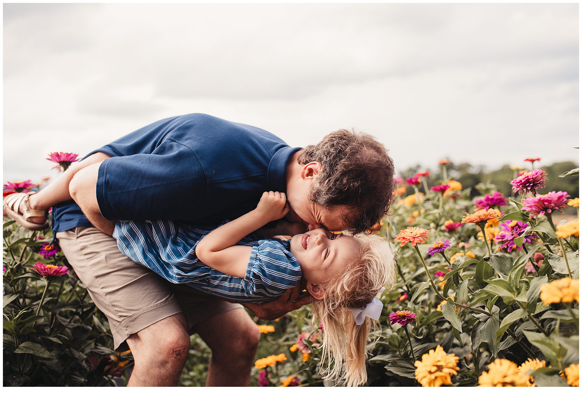Family photos among flower patches in Kansas